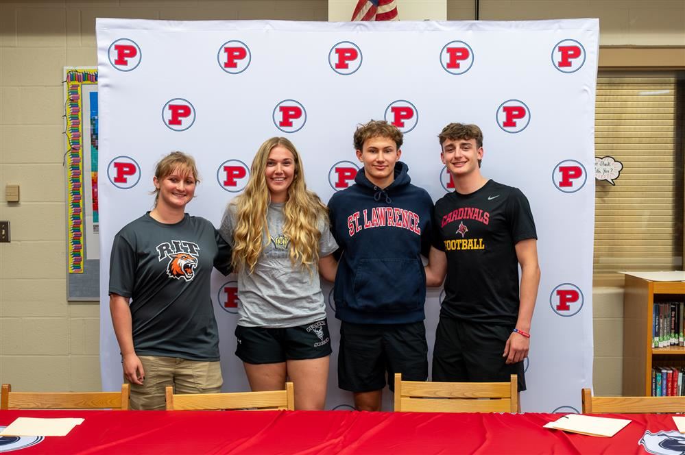 Students at Pulaski High School posing after signing their letters of intent to play a collegiate s